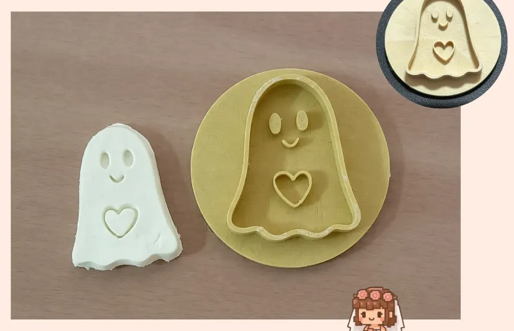 Ghost holding a heart, cookie cutter and clay stamp